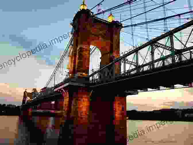 Cincinnati Skyline At Sunset, Showcasing The Iconic Roebling Suspension Bridge Cincinnati Revealed: A Photographic Heritage Of The Queen City (Images Of America)